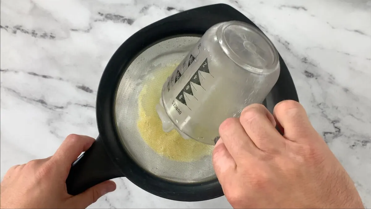 Strain ice water into the mixing bowl.