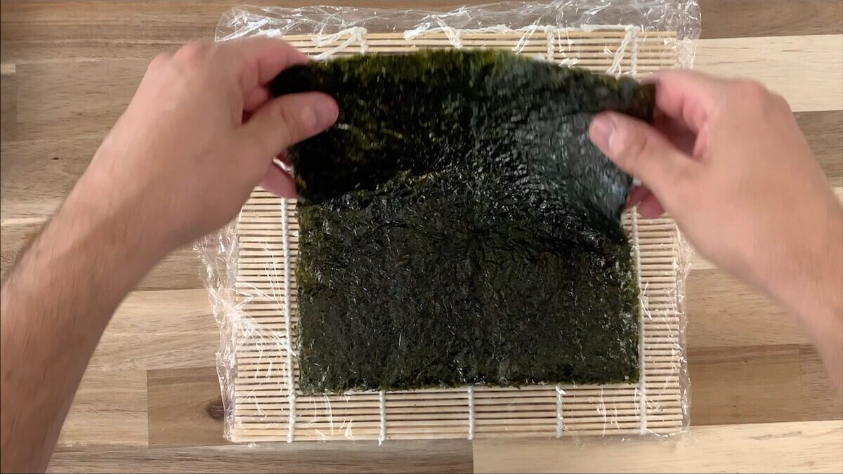 Flip the nori sheet as I like to prepare the vegetable tempura roll as an uramaki roll.