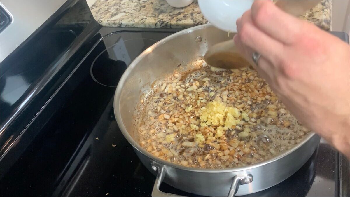 After onions are cooked, add minced garlic and cook for an additional minute.