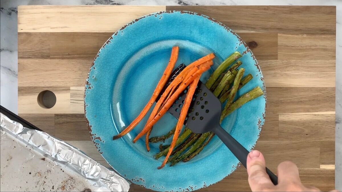 Remove carrots and asparagus from oven