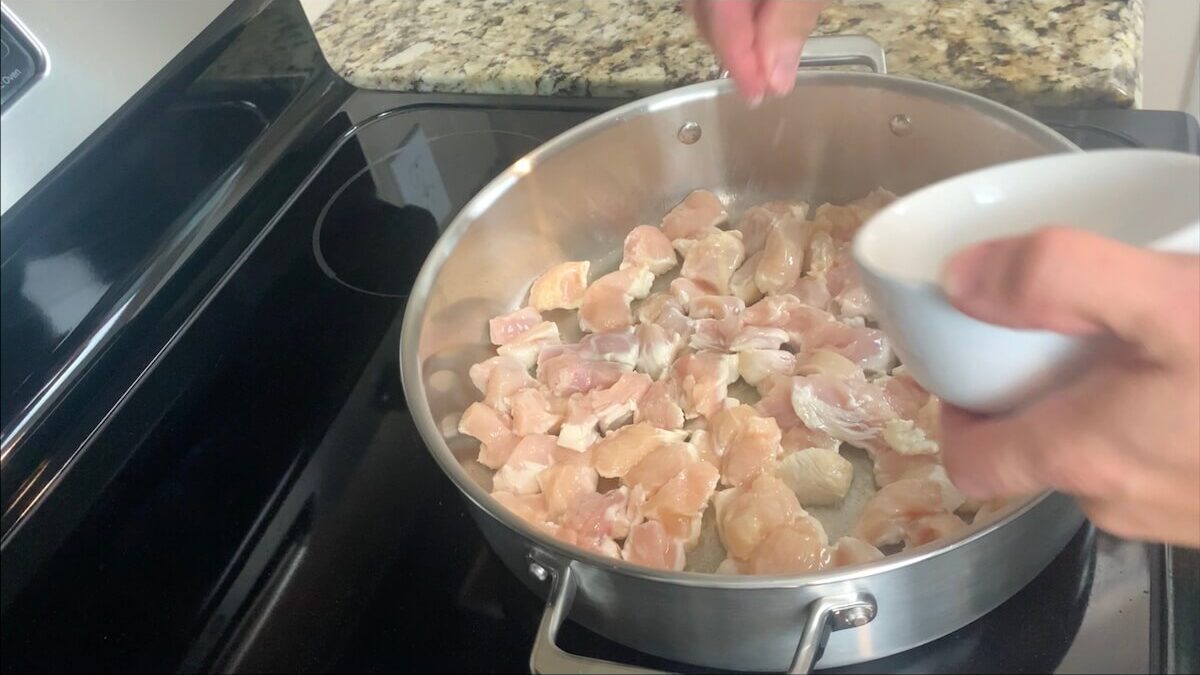 Add chicken in a single layer to the pan and season with salt and pepper.