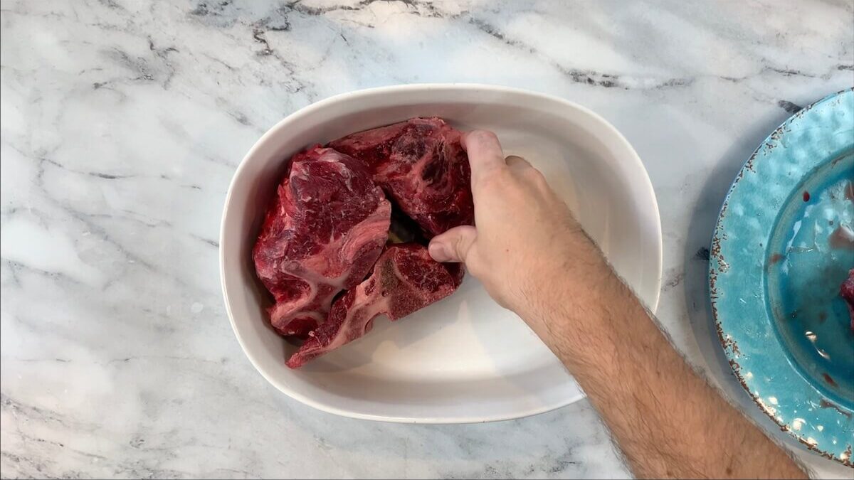 Add beef bones to roasting pan for beef broth.