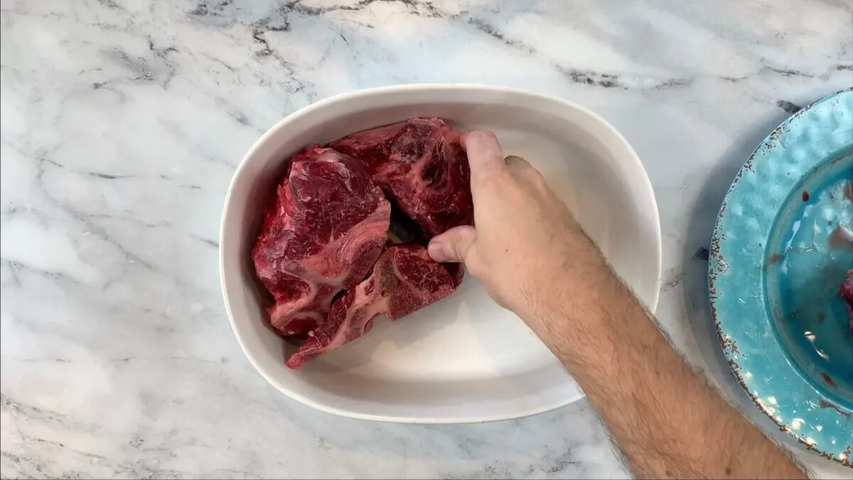 Add beef bones to roasting pan for beef broth.