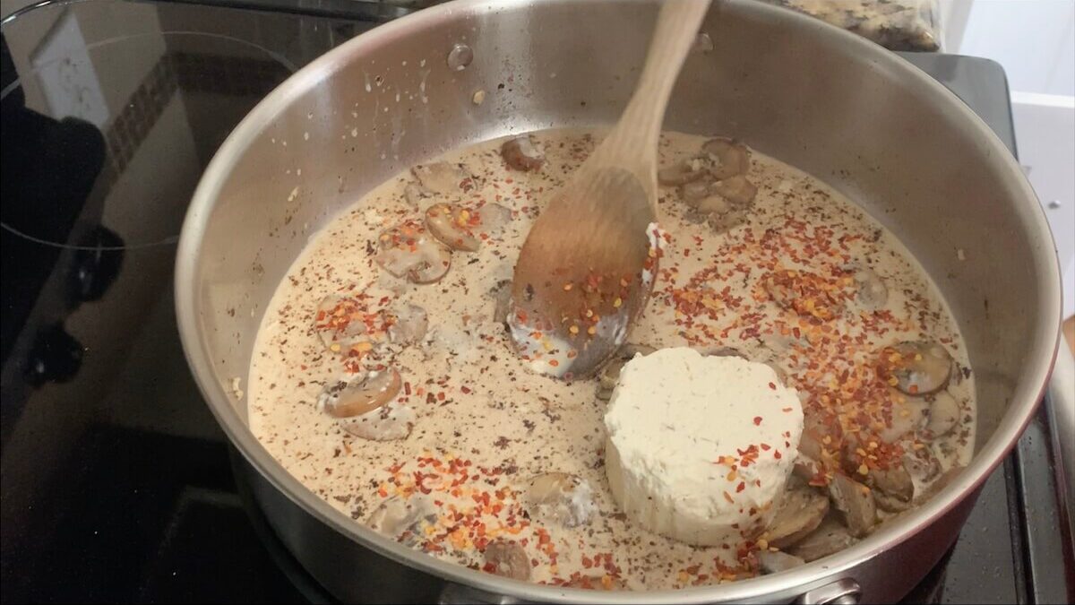 Add cream, Boursin cheese, and red pepper flakes to the pan.