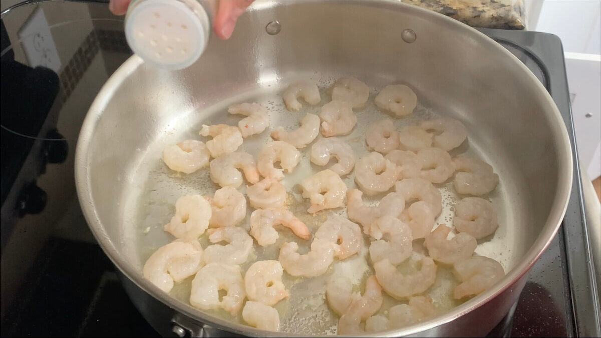 Cook shrimp in saute pan and season with garlic salt.  I think this adds a depth of flavor to the Boursin cheese pasta.