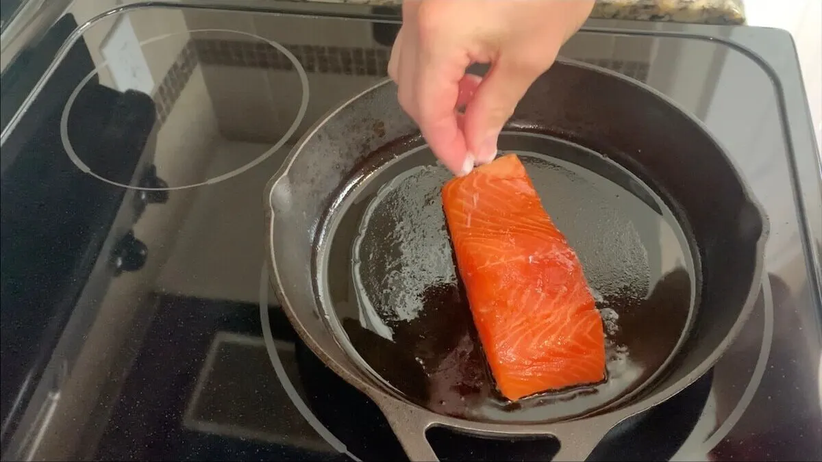 Lightly season the salmon with salt and pepper.