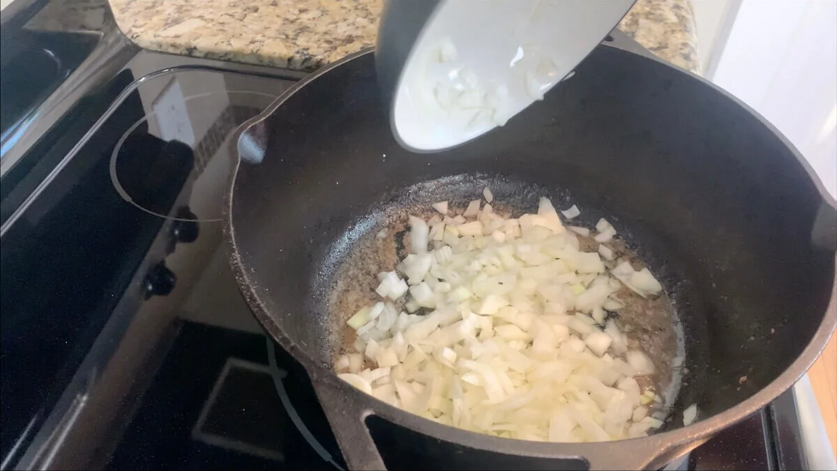 Cook onions in a large cast iron skillet.